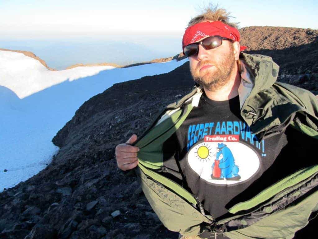 Rob wearing a secret aardvark t-shirt on top of a snowy mountain