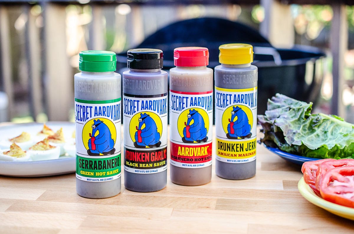 Bottles of Secret Aardvark sauces (Drunken Jerk, Aardvark Habanero, Drunken Garlic, and Serrabanero)