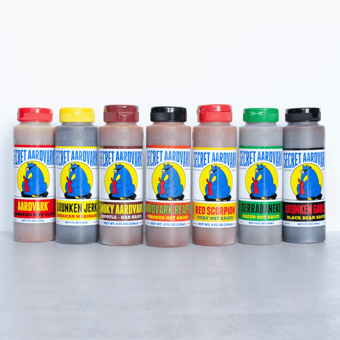 7 bottles of saice lined up 
