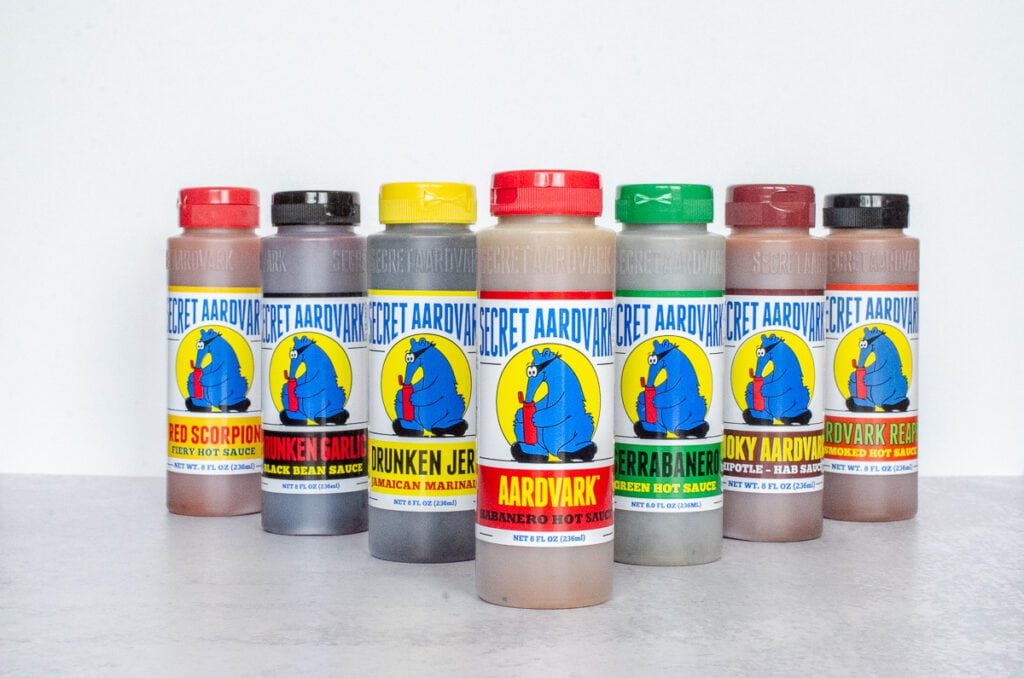 Box of 3-pack gift set. Box is blue with the Aardvark logo and a window cut out showing the three hot sauces: Aardvark Habanero, Serrabanero, and Smoky