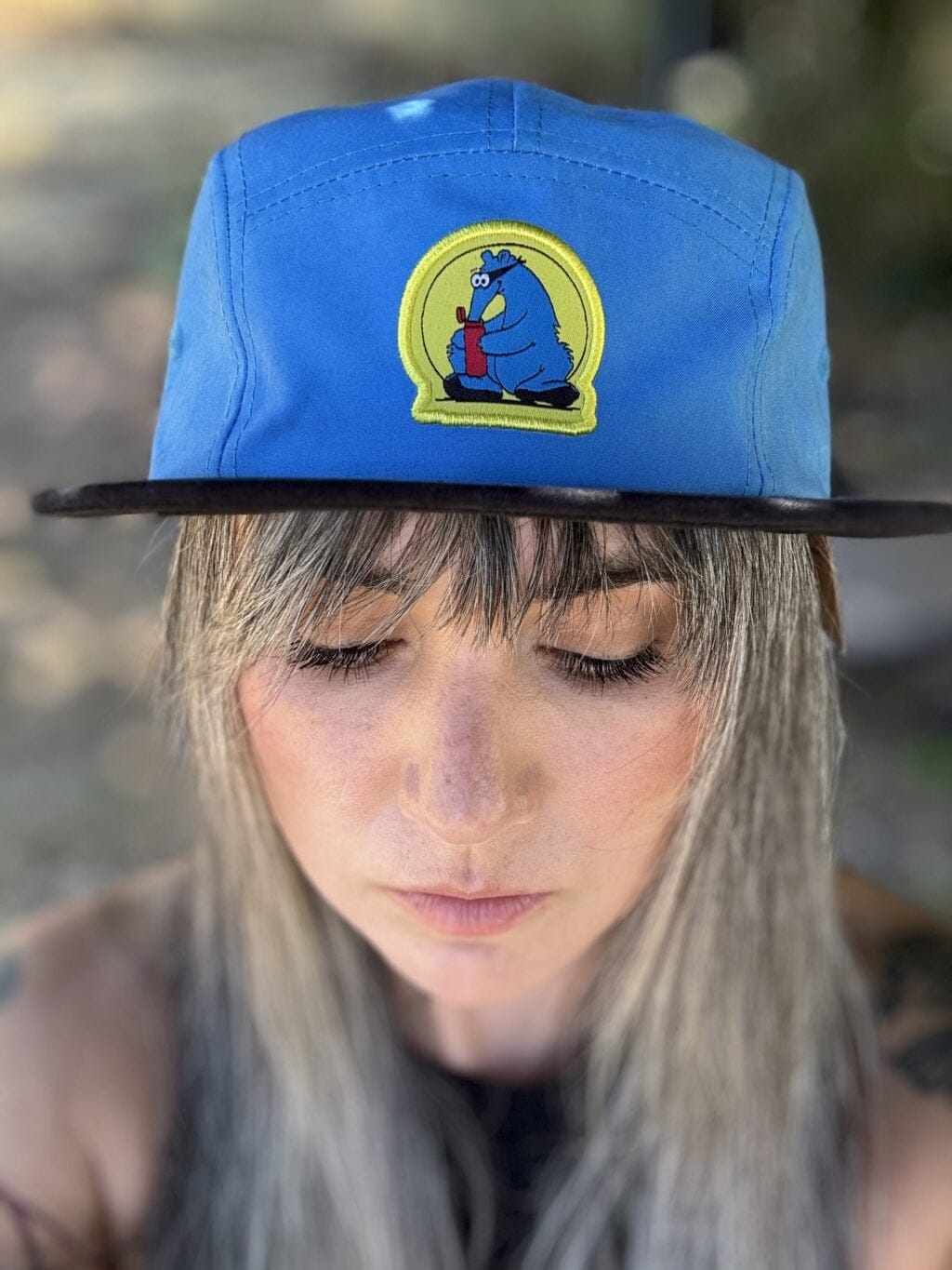 women wear blue aardvark camper hat