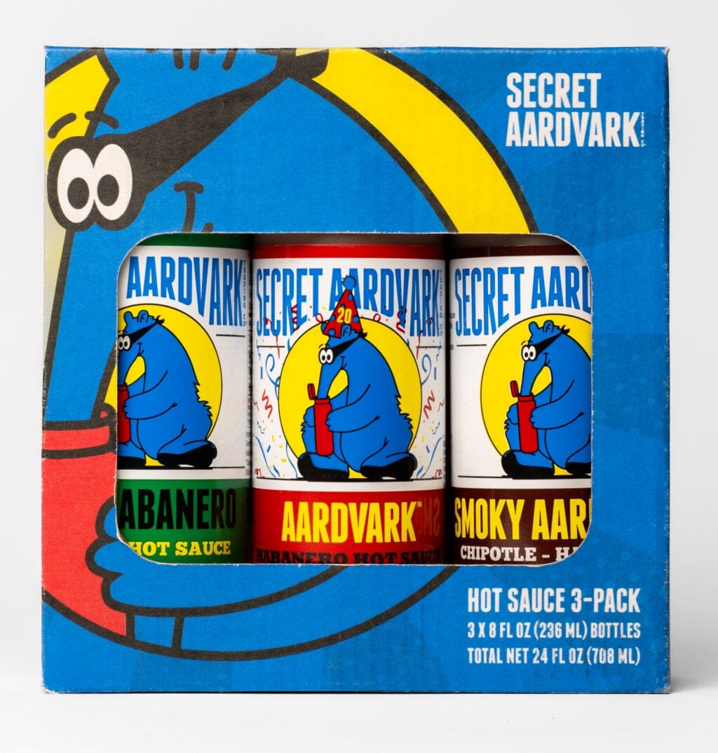 Box of 3-pack gift set. Box is blue with the Aardvark logo and a window cut out showing the three hot sauces: Aardvark Habanero, Serrabanero, and Smoky