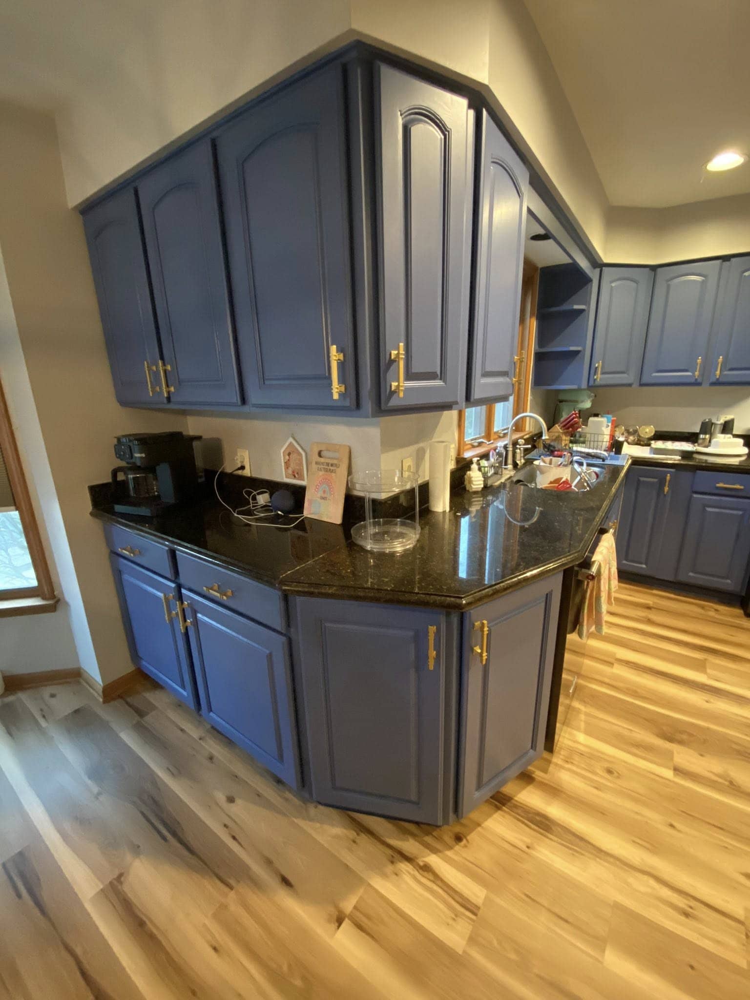 The same kitchen cabinets refinished in deep navy blue