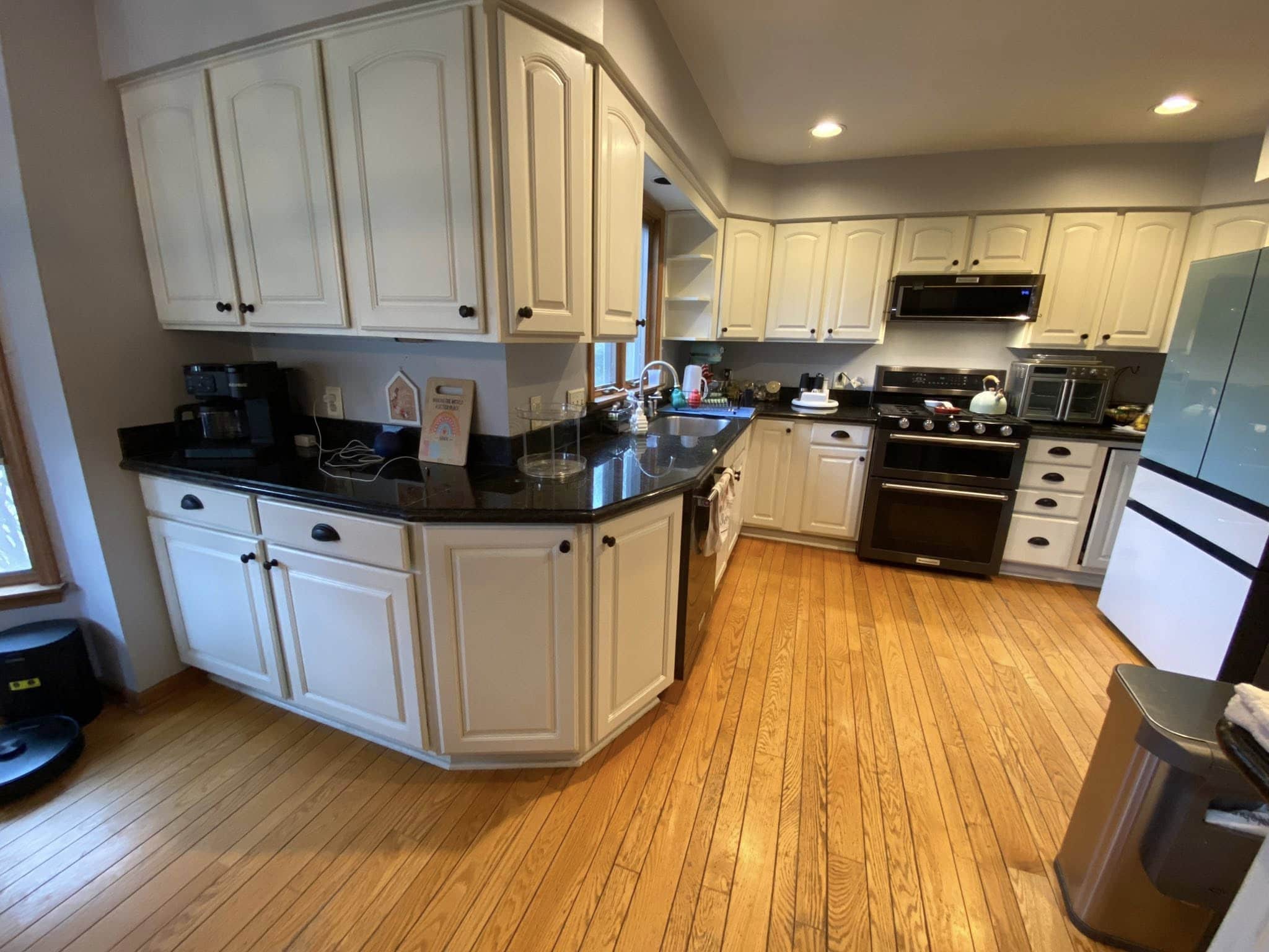 Cream colored kitchen cabinets before refinishing