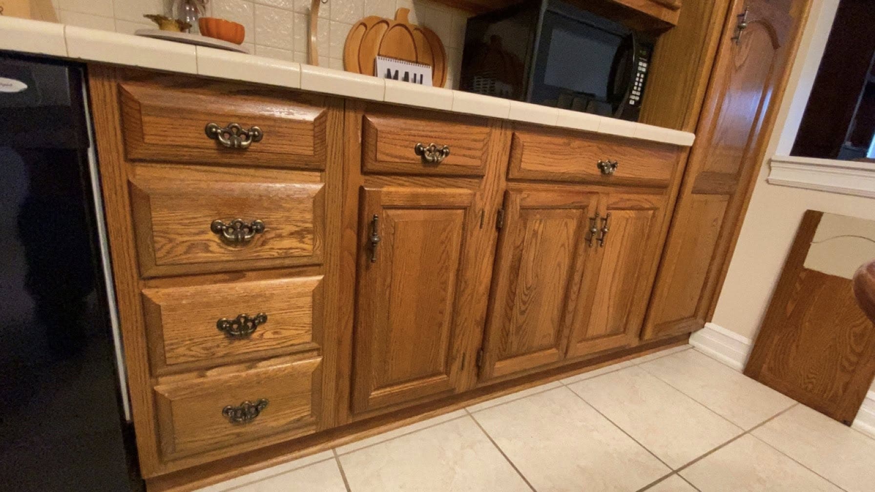 Golden oak kitchen cabinets before refinishing