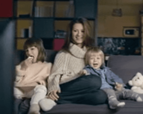 family enjoying time together watching television