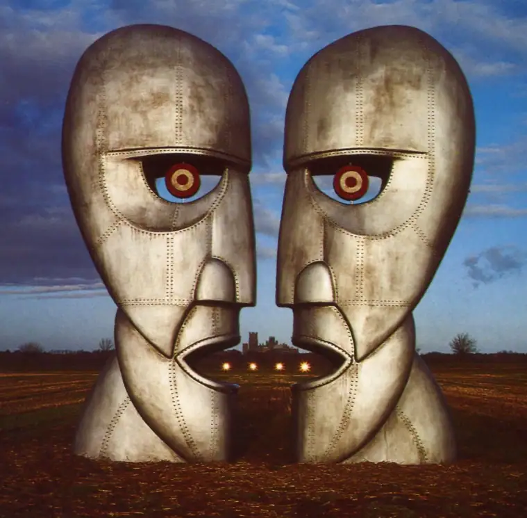 The Division Bell cover with two metal heads facing each other in a field