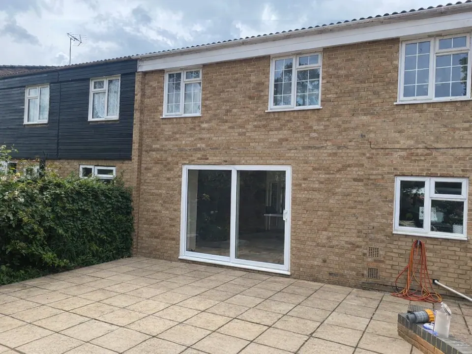 house with white framed sliding door