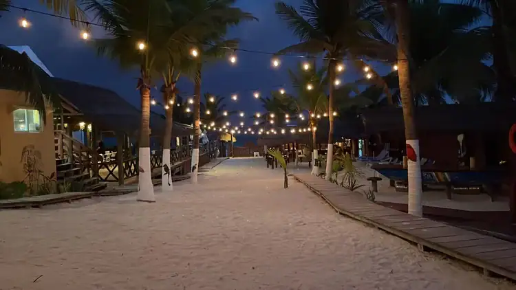 Night view of the Diving Bar and pool lights at Squalo Beach Club