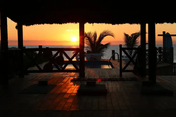 Yoga session at sunrise at Squalo Beach Club