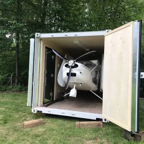 Flight school classroom by summer, airplane storage unit by winter