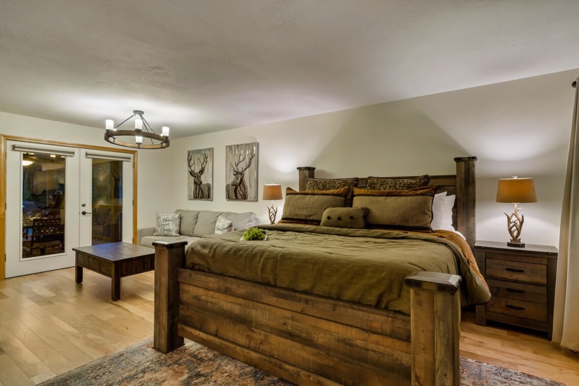 Spacious primary bedroom with en suite featuring an 42-inch TV for relaxing evenings.