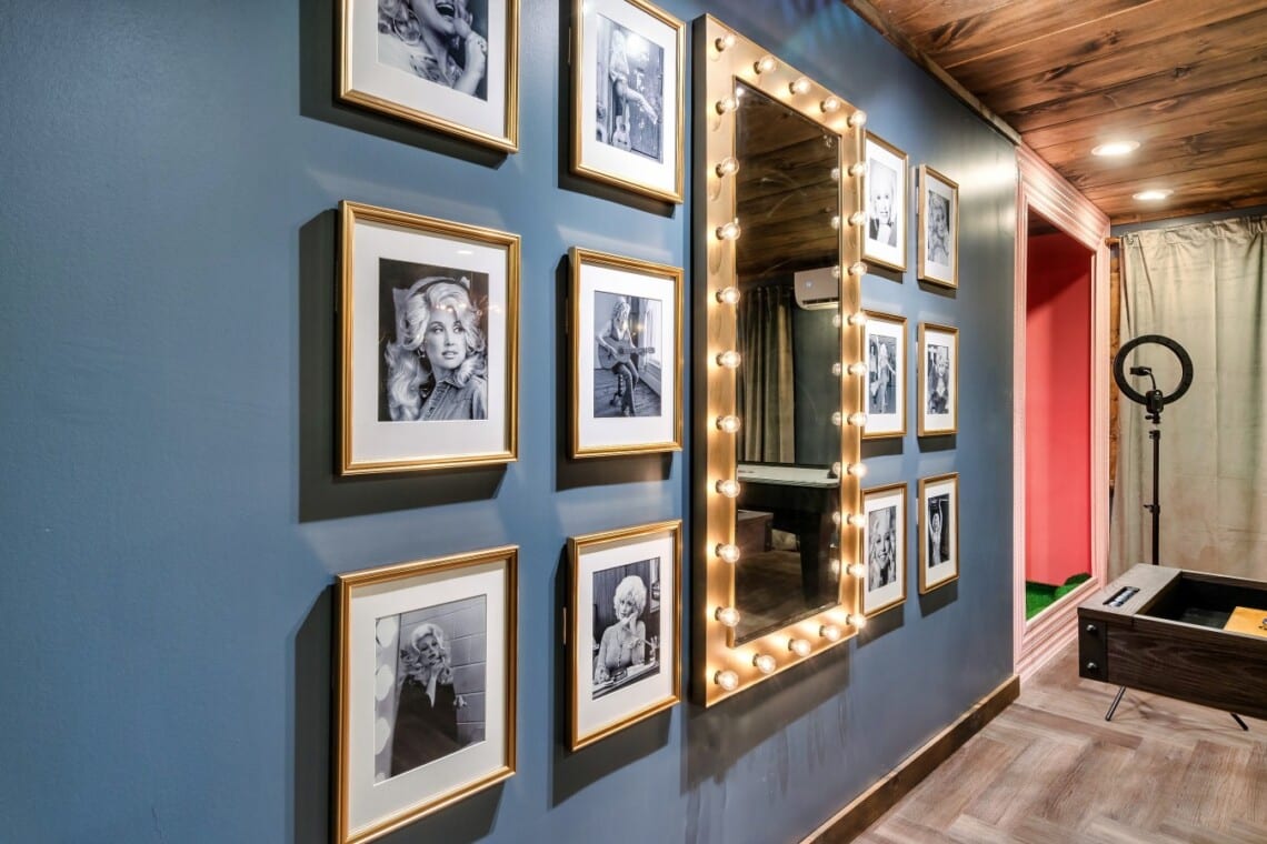 Dolly-themed feature wall with the marquee mirror; perfect for fun photo moments