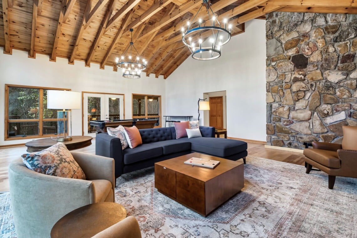 Vaulted ceilings, a fireplace, and a big smart TV. This is where the whole group ends up at night.