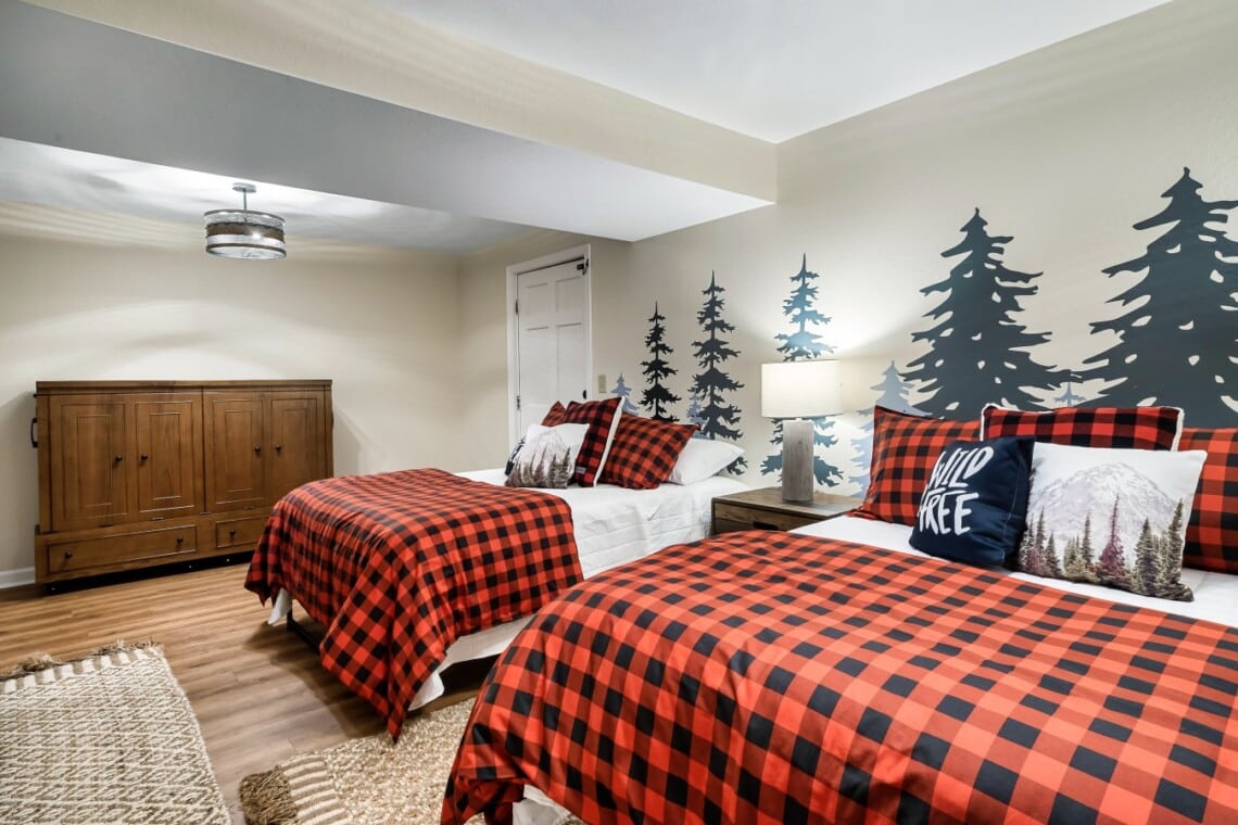 Lower-level bedroom: two full beds, Murphy bed, and a 42-inch TV. Flexible for the however your group splits up.