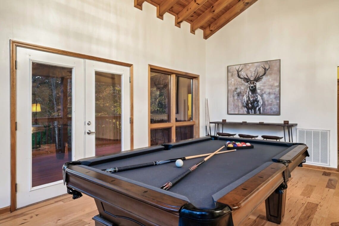 Enjoy a game of pool just steps from the deck and outdoor seating.