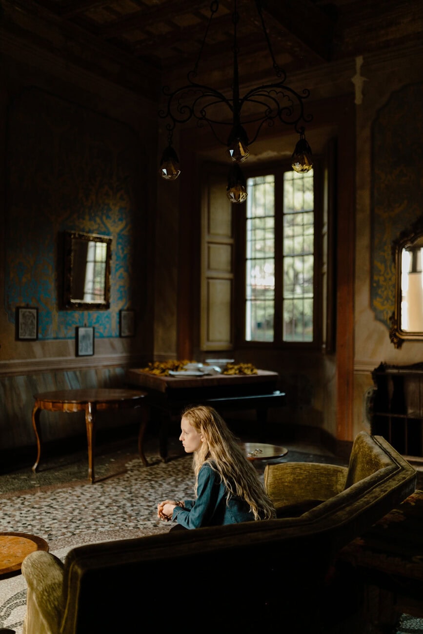 Rustic Italian interior with warm window light, wedding getting-ready moment - Marco & Filippo wedding