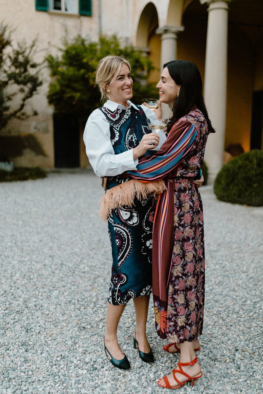 Grooms embracing on their wedding day