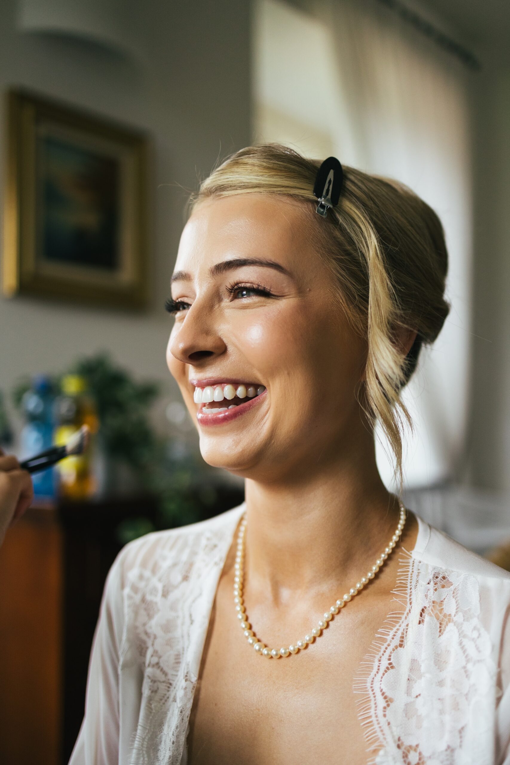 Bride laughing during hair and makeup before her Bellagio, Lake Como wedding