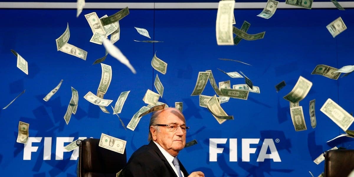 Fifa official at stadium with money falling, FIFA logo background, sports finance, cash flow, soccer funding concept.