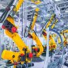 robotic arms in a car plant