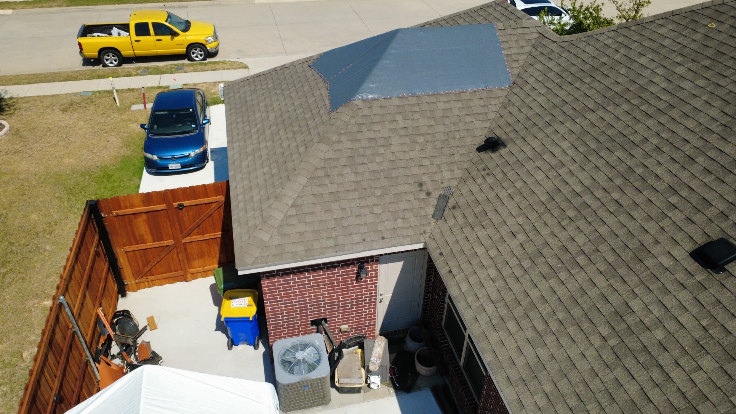 Temporary covered roof section documented before repair work in Krum Texas