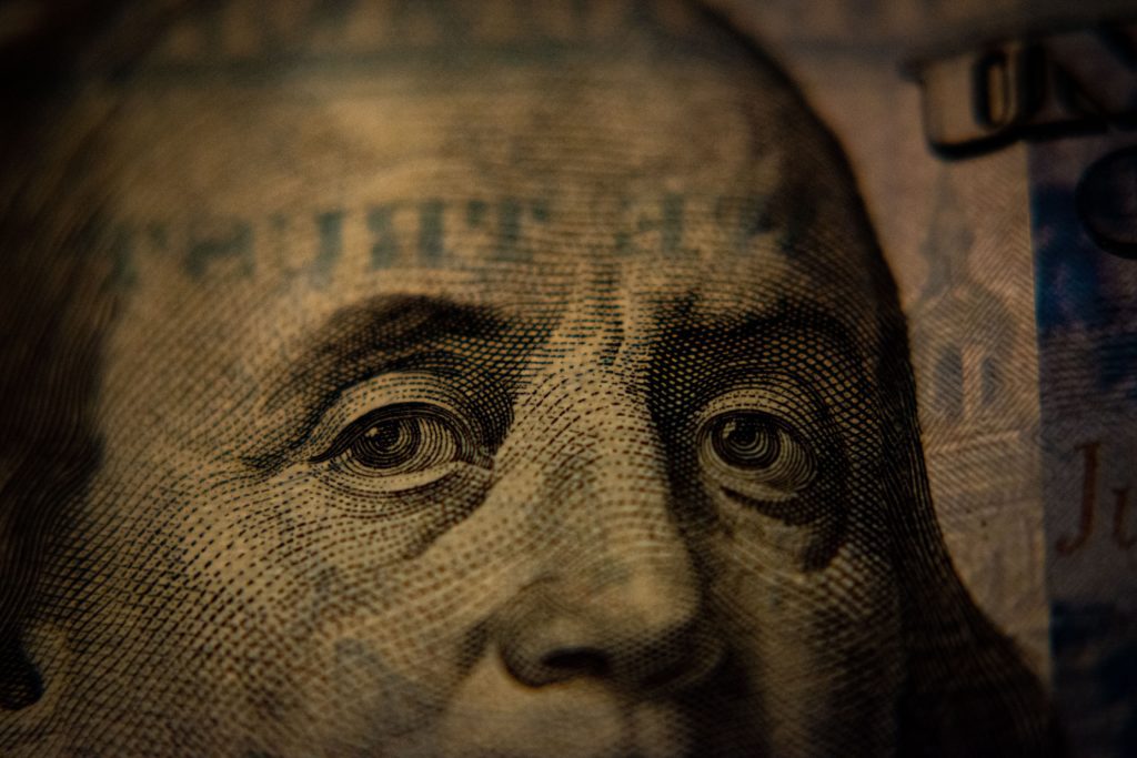 hundred dollar bill face for quantitative tightening article showing monetary contraction and mortgage interest rates