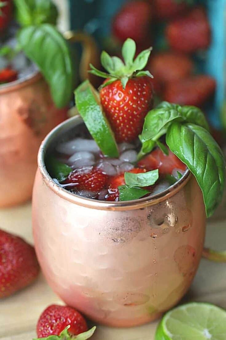 This simple Strawberry Basil Moscow Mule is a refreshing drink recipe. Grab your copper mugs and make this easy cocktail recipe. 