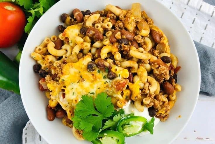 Prepare a fulfilling meal for the family with this wholesome and hearty Chili Mac. Loaded with flavor, this easy comfort food recipe is perfect to make for lunch or dinner with a side of cornbread or garlic bread! Chili Mac and Cheese is an easy weeknight meal idea.