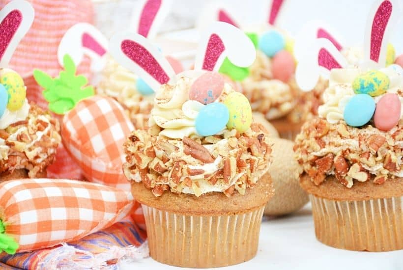 Enjoy the taste of these sweet, flavorful baked treats just in time for the Easter holiday with this recipe for Carrot Cake Bunny Cupcakes. Not only do they taste delicious, but they’re also so much fun to prepare! These Easter cupcakes are extra moist with a rich and silky cream cheese frosting swirled on top. These easy cupcakes are perfect for an Easter party or to serve as an Easter dessert after dinner.