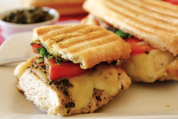 Skip the traditional ham and cheese and make a more fulfilling meal with these Pesto Chicken Sandwiches. Made with chicken, cheese, and tomatoes, you will love the taste of this flavorful sandwich.