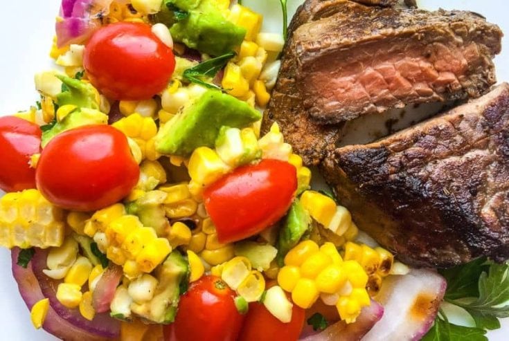 Ditch the typical pasta salad and go for something lighter and refreshing with this delicious grilled Corn Tomato Salad recipe. It’s the perfect summer side to serve. This easy summer salad pairs two stars of the season - corn and tomatoes, making this healthy salad recipe a winner.