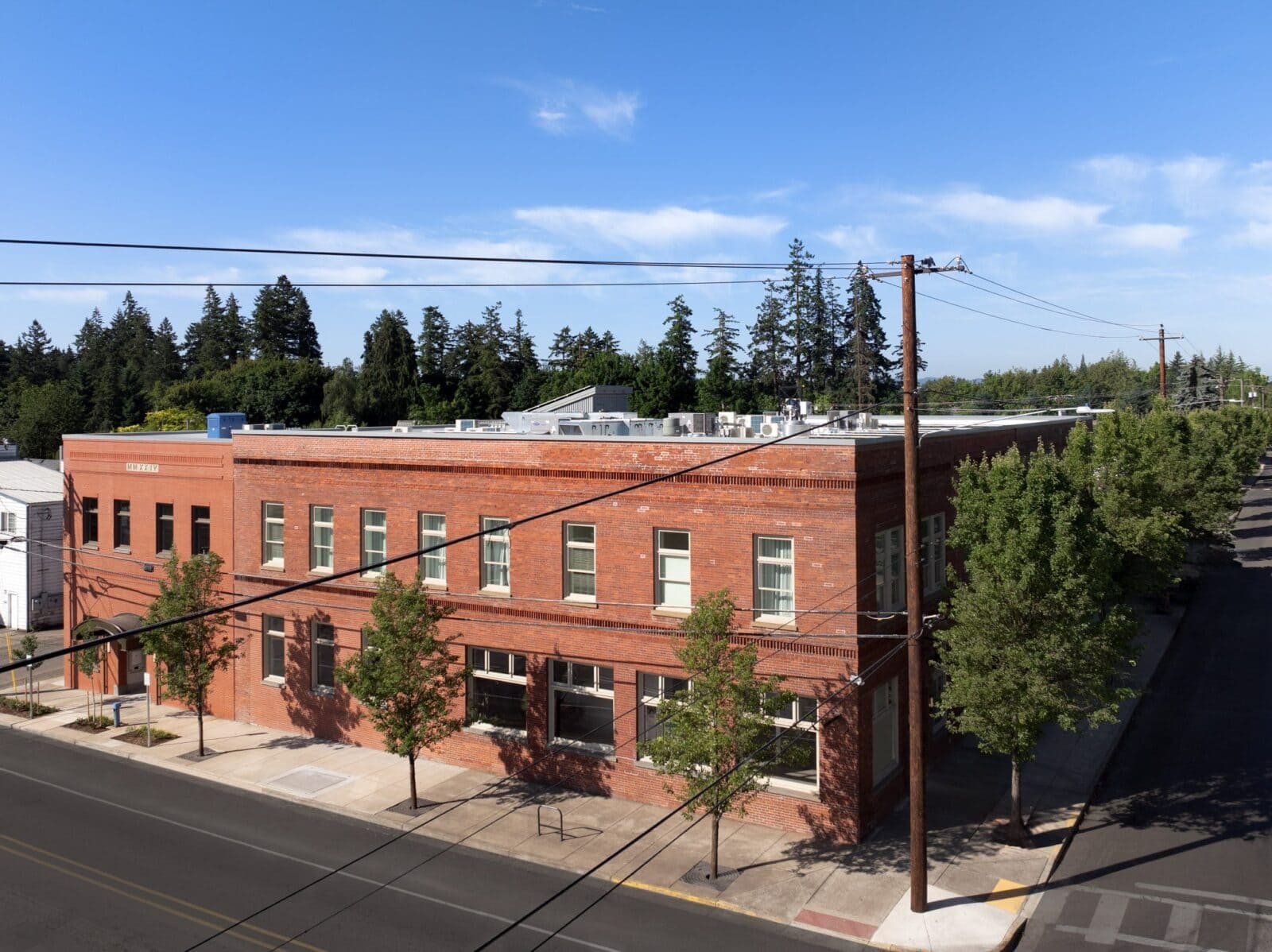 Street corner angle of The Inn at Dayton, a historic red-brick building with quiet surrounding streets