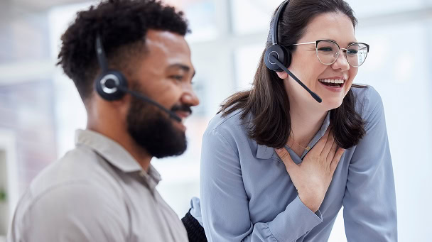 Customer support team using intelligent assistant for efficient service.