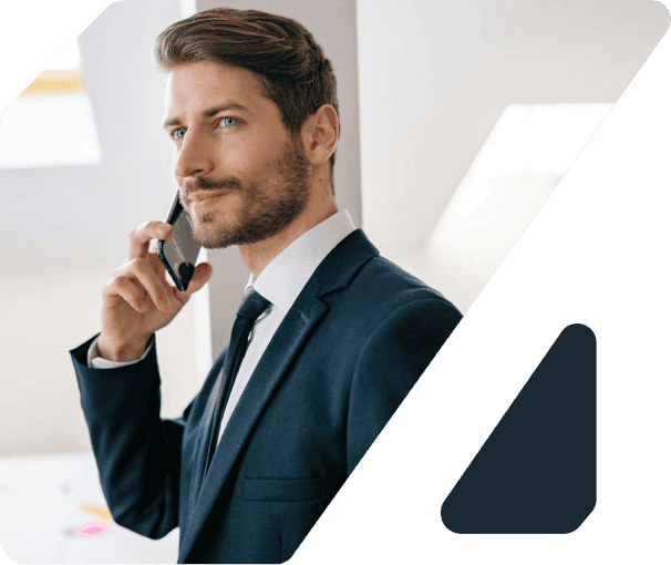 Professional man using an intelligent assistant on his phone in an office setting.