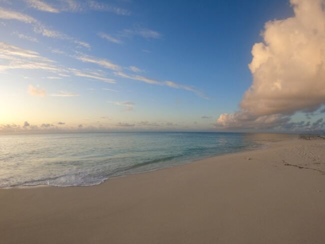 Deserted beach at sunset on the North Coast of Denis Private Island