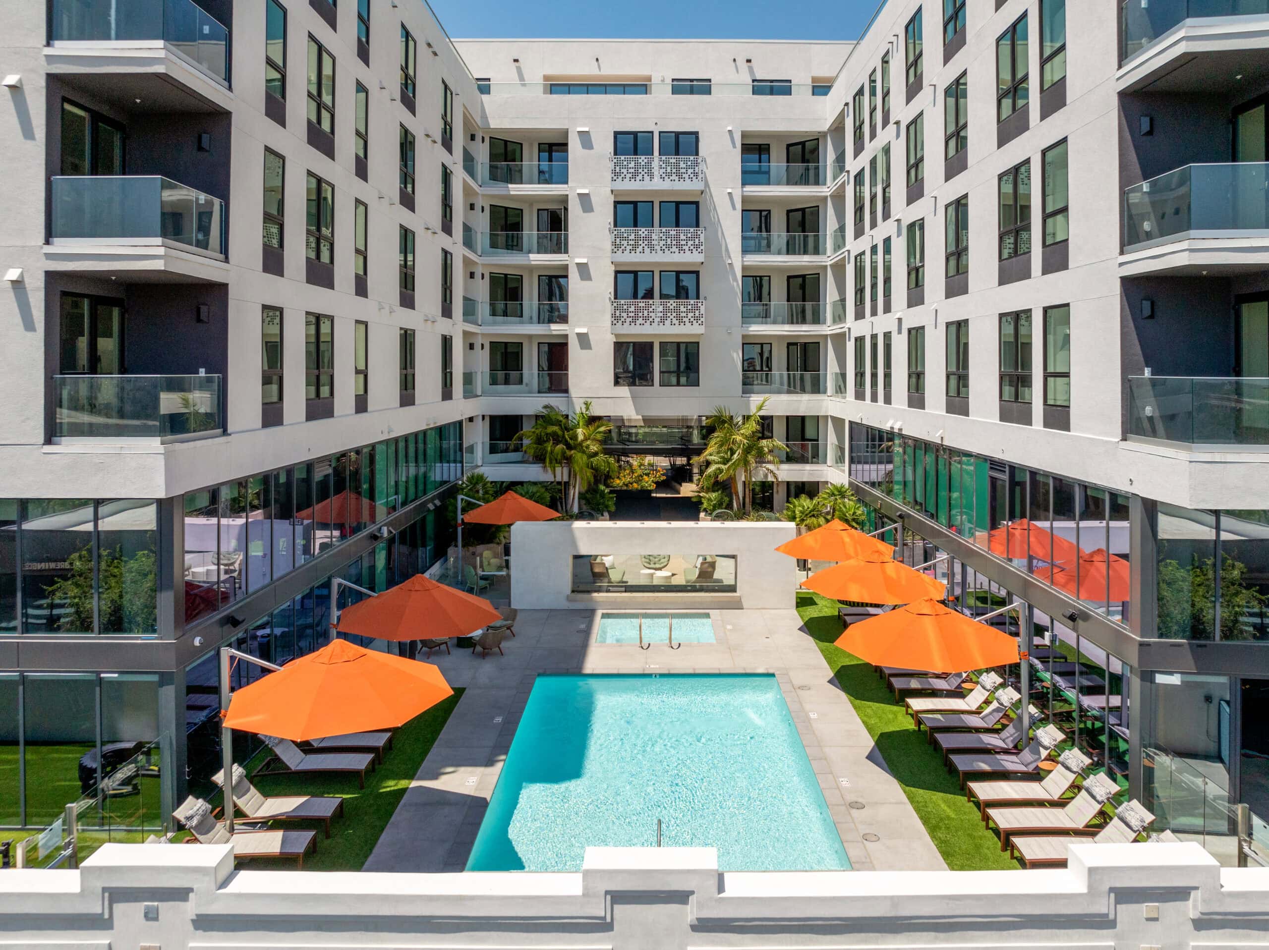 An aerial view of a courtyard pool and The Wyatt apartments in San Diego.