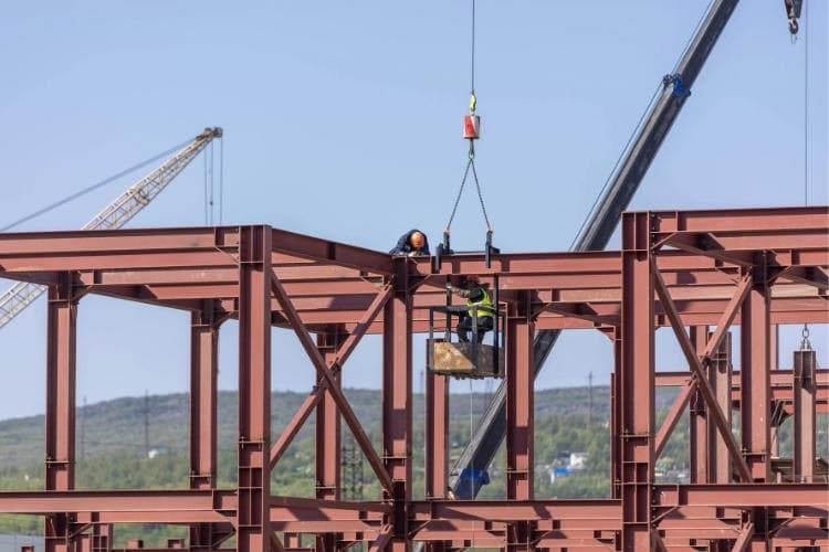 Pre-engineered steel building frame being erected on site in Canada