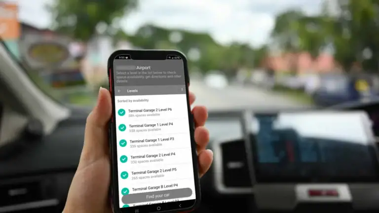 A car passenger using a smartphone with a parking app powered by Park Assist's Automated Parking Guidance System