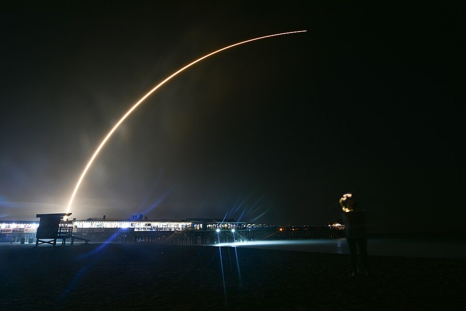 Night rocket launch from Cocoa Beach Pier