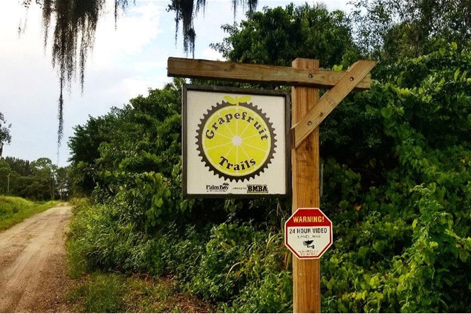 Entrance sign for Grapefruit Trails mountain biking park in Palm Bay Florida