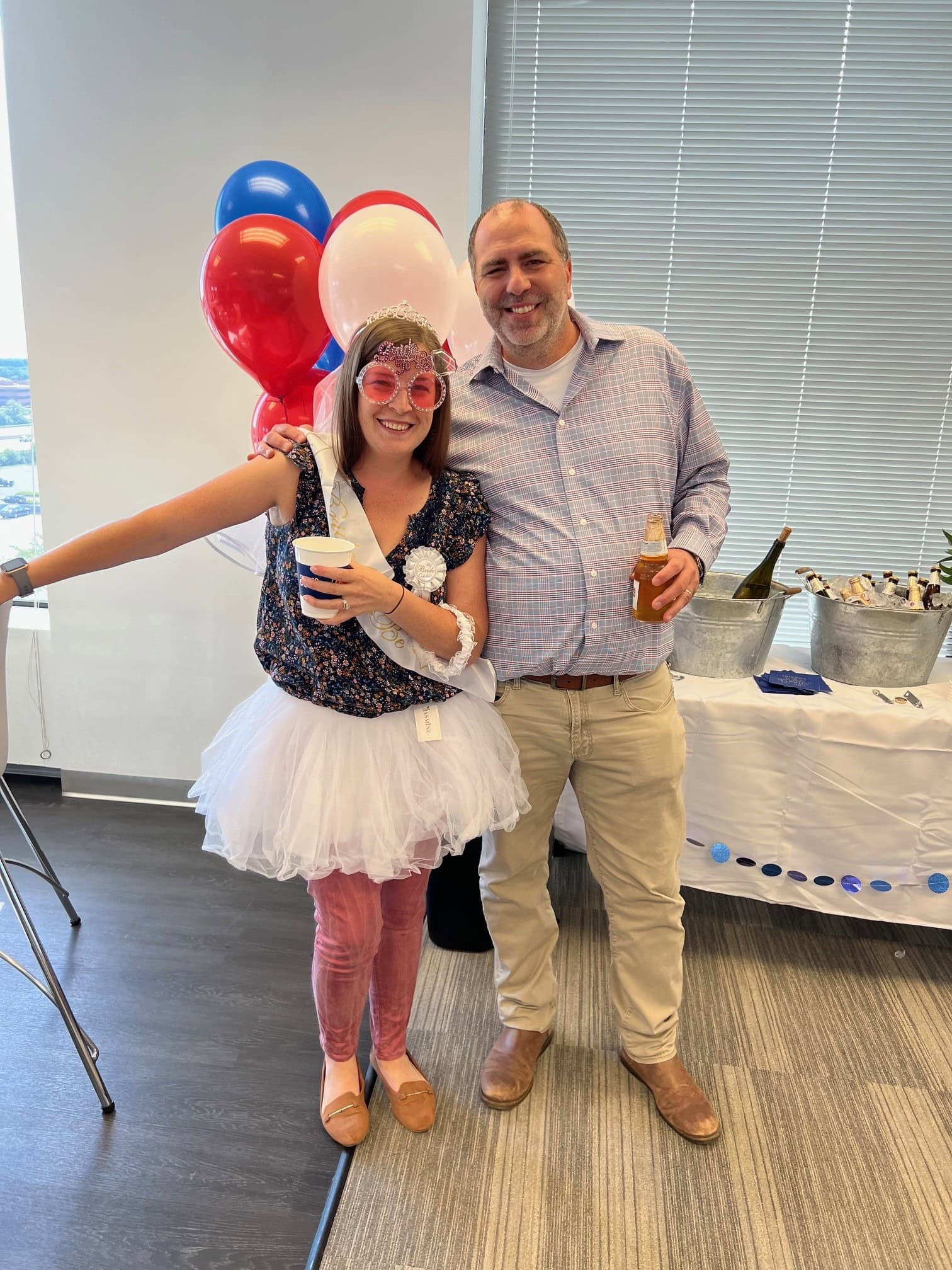 Celebration with balloons and festive attire.