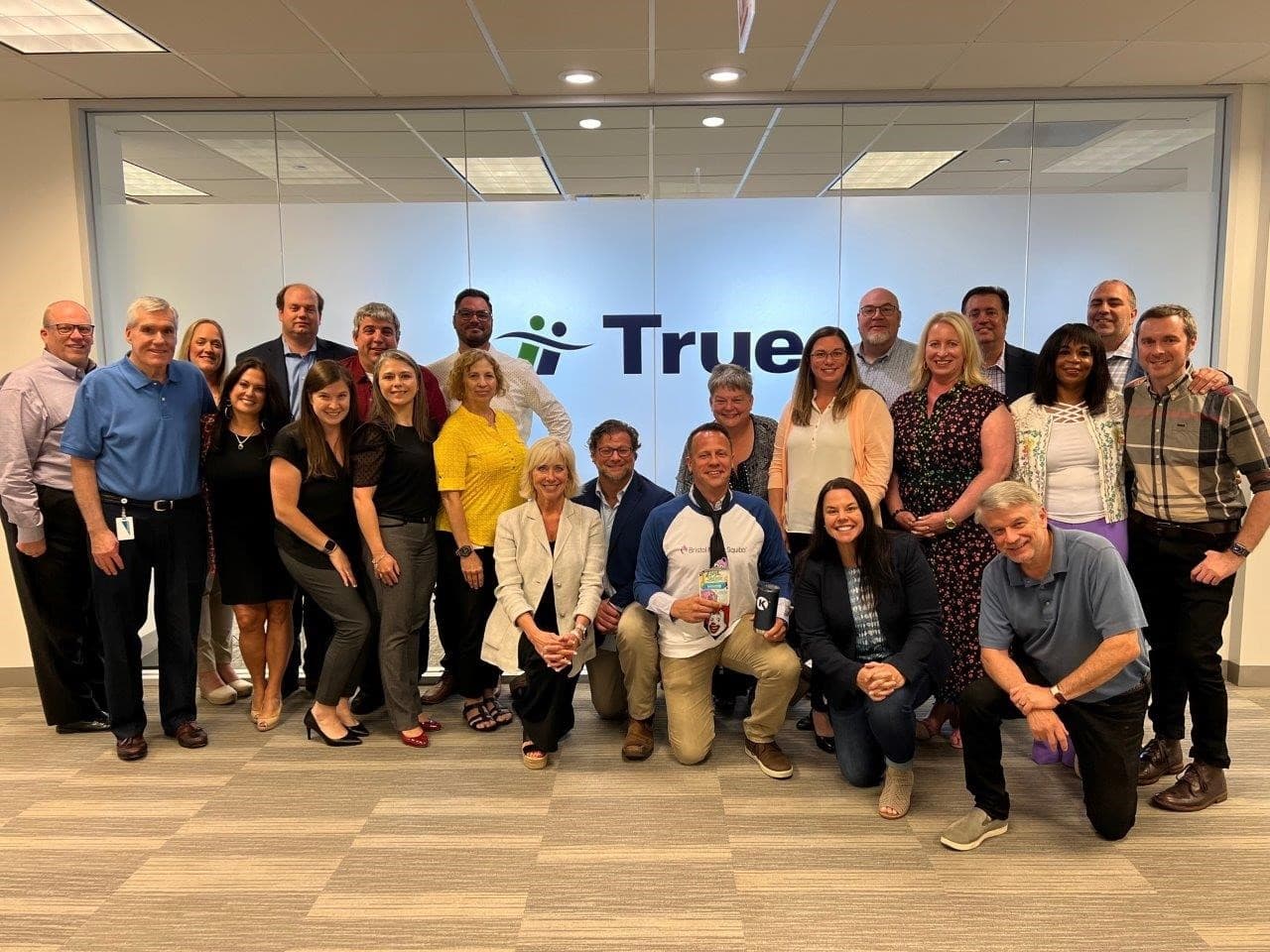 Group photo of colleagues posing together.