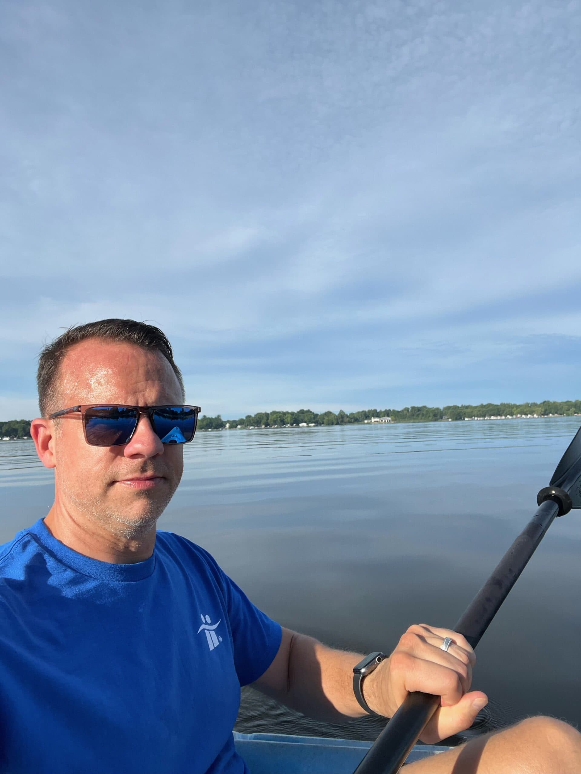 Individual kayaking on a calm lake