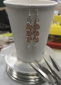 A pair of handmade chain mail earrings