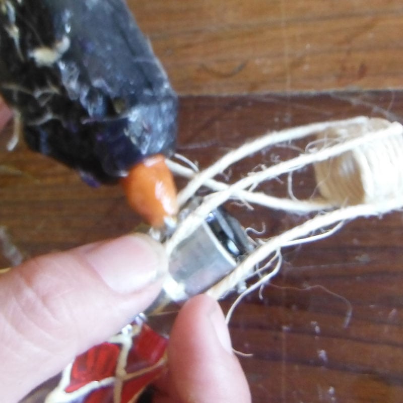 attaching the baskets to the lightbulbs