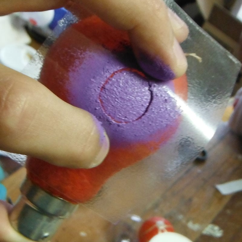 sponging colourful dots on a lightbulb