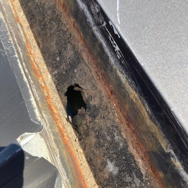 Rusted through gutter due to lack of gutter meaintenance