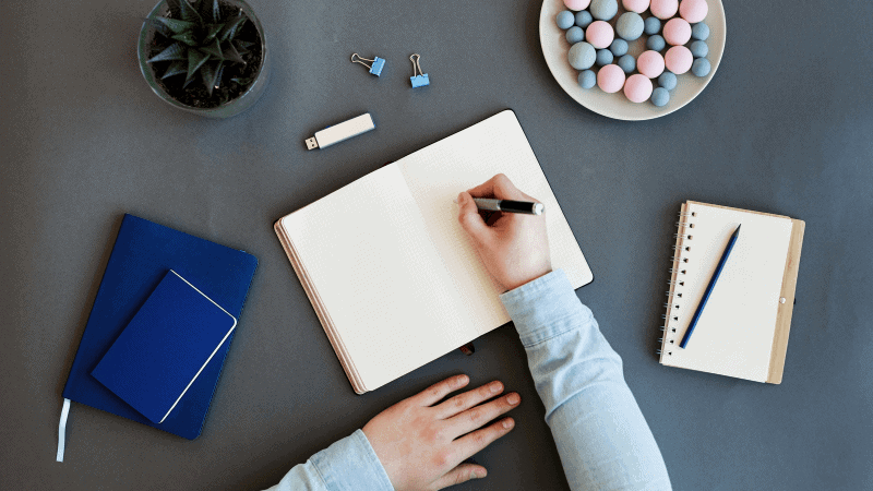 A woman writing in her journal