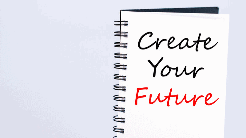 The positive affirmation create your future written on a blackboard